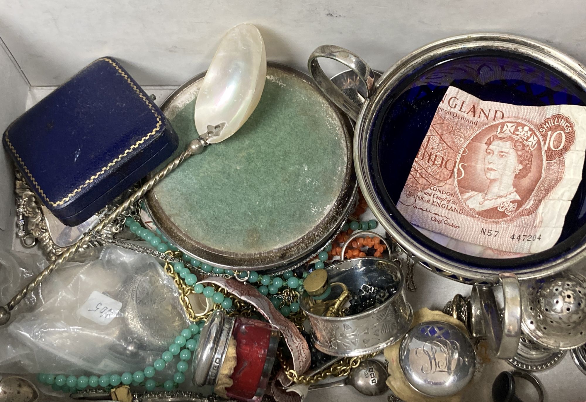 A quantity of silver, including wine labels and assorted costume jewellery.